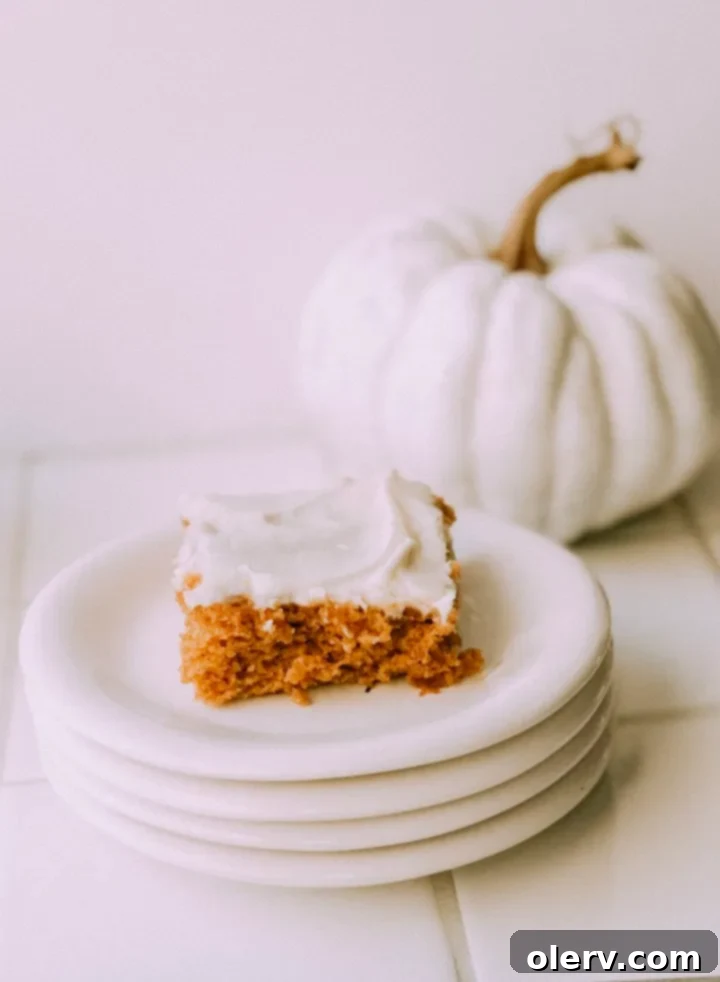 Spiced Pumpkin Sheet Cake with Cream Cheese Frosting 4 A large pan of freshly baked Pumpkin Sheet Cake, ready for frosting.