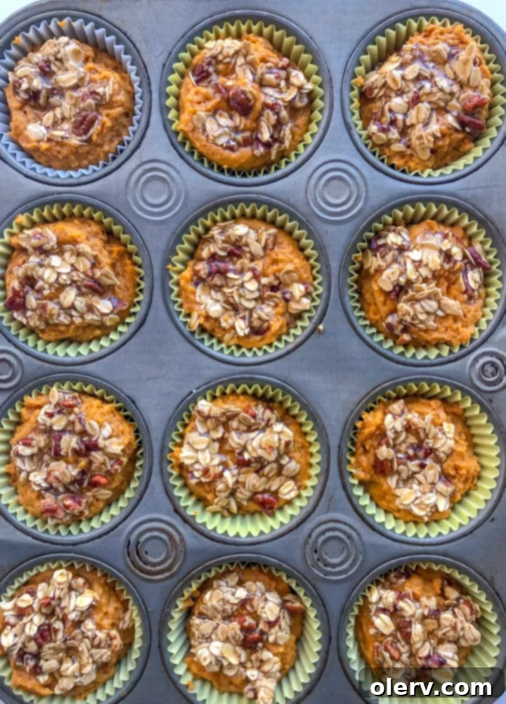 Wholesome Pumpkin Spice Muffins 4 Healthy Pumpkin Muffins arranged on a wire rack
