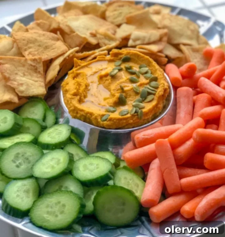 Close-up of Savory Pumpkin Hummus texture, showing its creamy consistency and subtle spice garnish