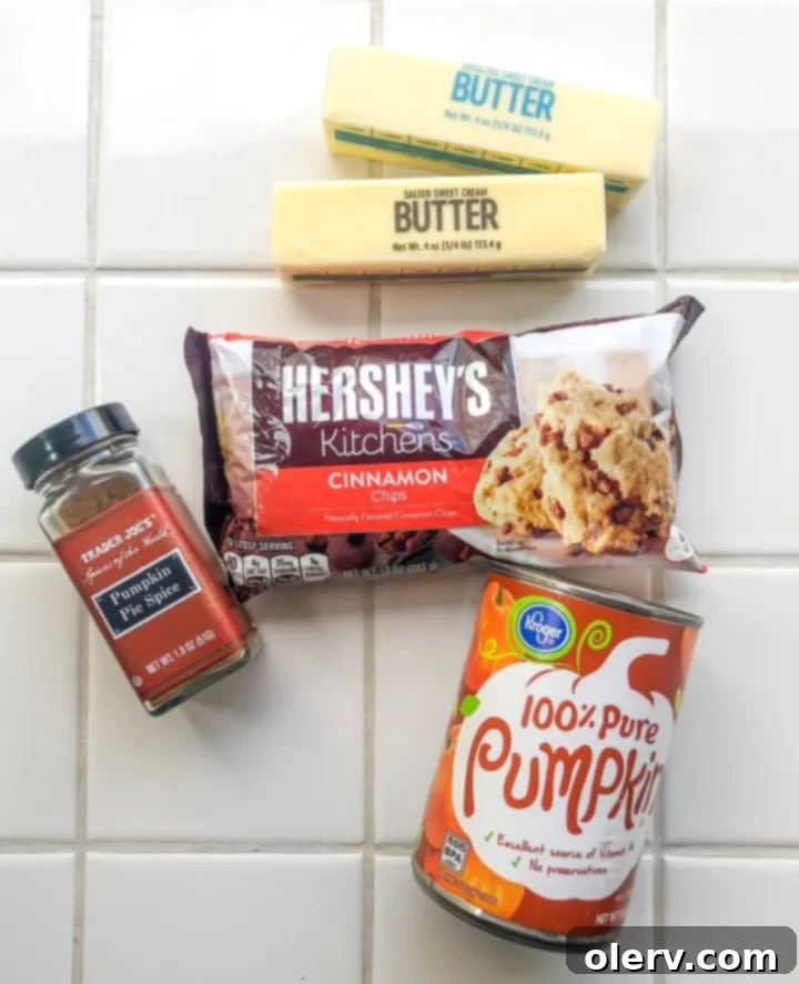 Freshly baked chewy cinnamon chip pumpkin cookies cooling on a wire rack.