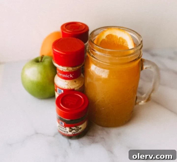 Instant Pot Holiday Magic 11 Sliced apples and quartered oranges ready for homemade apple cider.
