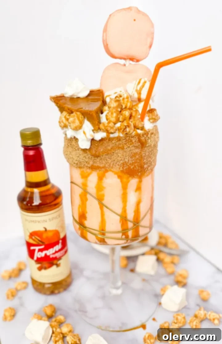 Decadent Caramel Pumpkin Pie Shake 4 Over-the-top Caramel Pumpkin Pie Shake adorned with caramel, whipped cream, and marshmallows