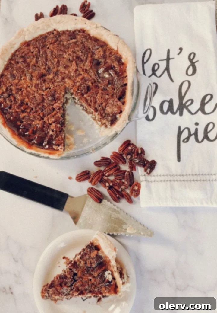 Effortless Pecan Perfection 6 A perfect slice of Easy Pecan Pie with a fork, showing the filling and nuts
