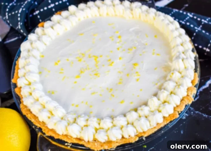 Velvety Tangy Lemon Pie 5 Beautifully presented Sour Cream Lemon Pie with a dollop of whipped cream