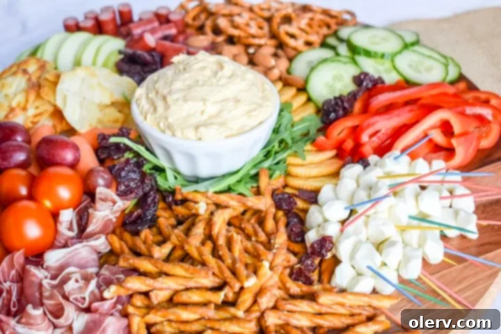 Grandma's Legacy Board: Cheese and Charcuterie 6 Assortment of cheeses on a charcuterie board