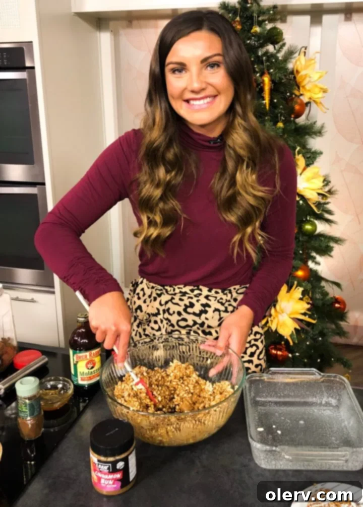 A close-up of a single Gingerbread Rice Krispie Treat with white chocolate drizzle
