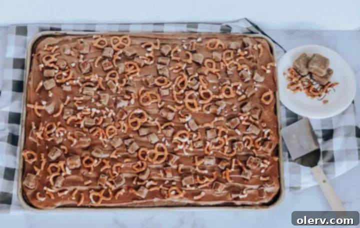 Irresistible Salted Caramel Pretzel Brownies 7 A single slice of Salted Caramel Pretzel Brownie served with a scoop of vanilla ice cream