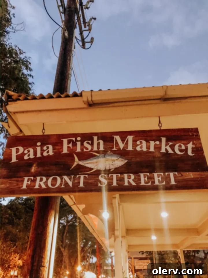 Unforgettable Maui: Your Essential Travel Companion 14 A plate of fresh seafood with rice and salad, a hearty meal from Paia Fish Market