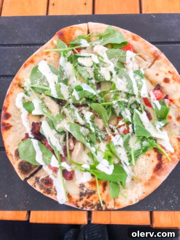 Unforgettable Maui: Your Essential Travel Companion 15 Artisan pizza with fresh toppings served on an outdoor patio overlooking the ocean