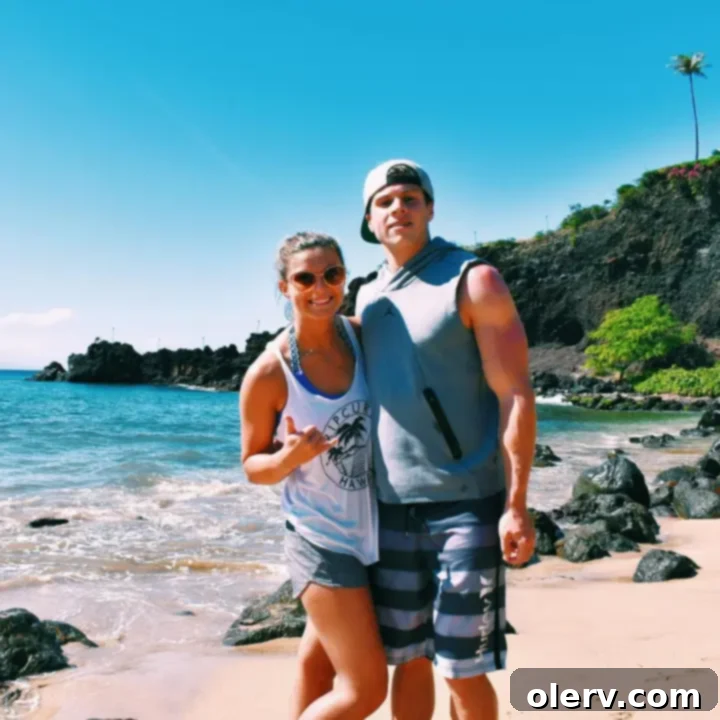 Unforgettable Maui: Your Essential Travel Companion 18 People enjoying cliff jumping at Black Rock Beach in Maui, with clear blue waters