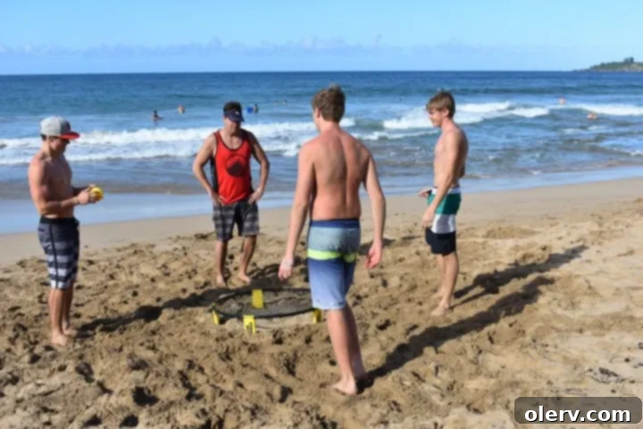 Unforgettable Maui: Your Essential Travel Companion 25 Friends playing Spikeball on a sandy beach in Maui