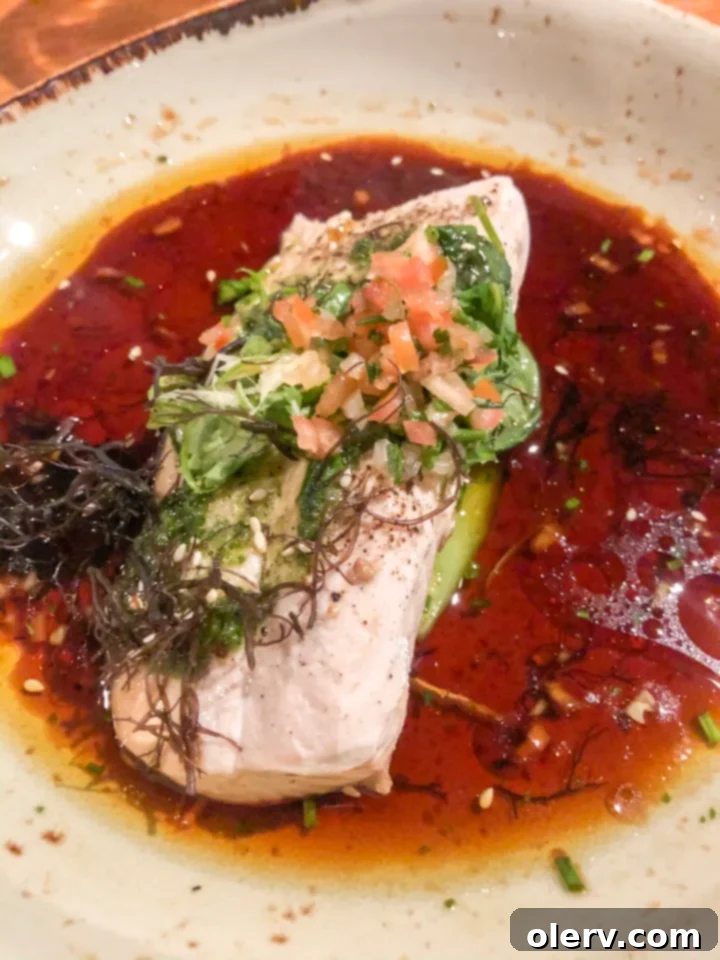 Unforgettable Maui: Your Essential Travel Companion 6 Delicious seafood dish with fresh fish and vibrant vegetables, a typical Hawaiian meal