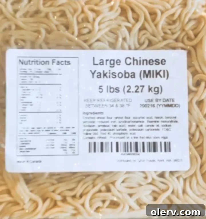 Ultimate Teriyaki Beef Yakisoba 5 Stir-frying beef and onions in a hot wok for Yakisoba