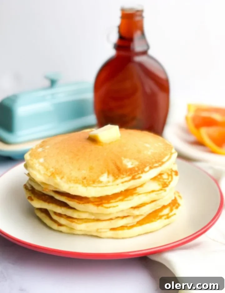 Effortless Overnight Sourdough Pancakes 4 A glass jar with active sourdough starter bubbling