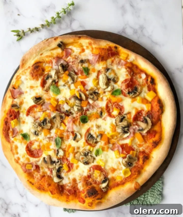 Effortless Sourdough Pizza Dough 2 Freshly baked sourdough pizza with rich toppings