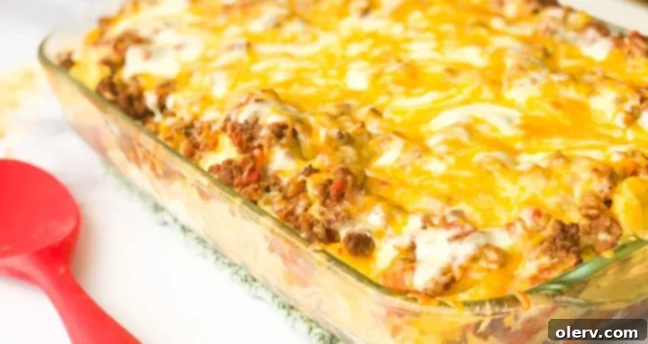Decadent Loaded Mac & Cheese Bake 2 Delicious Loaded Mac and Cheese Casserole fresh out of the oven, bubbling with cheese and meat.