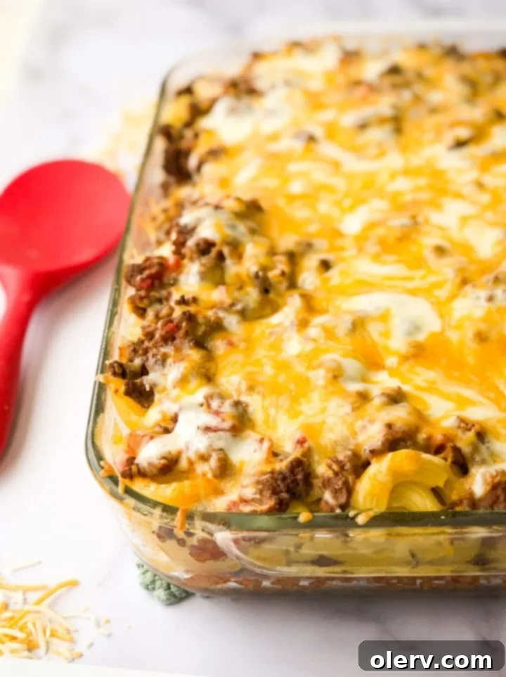 Decadent Loaded Mac & Cheese Bake 3 Close-up of the Loaded Mac and Cheese Casserole, showing the layers of pasta, beef, and melted cheese.