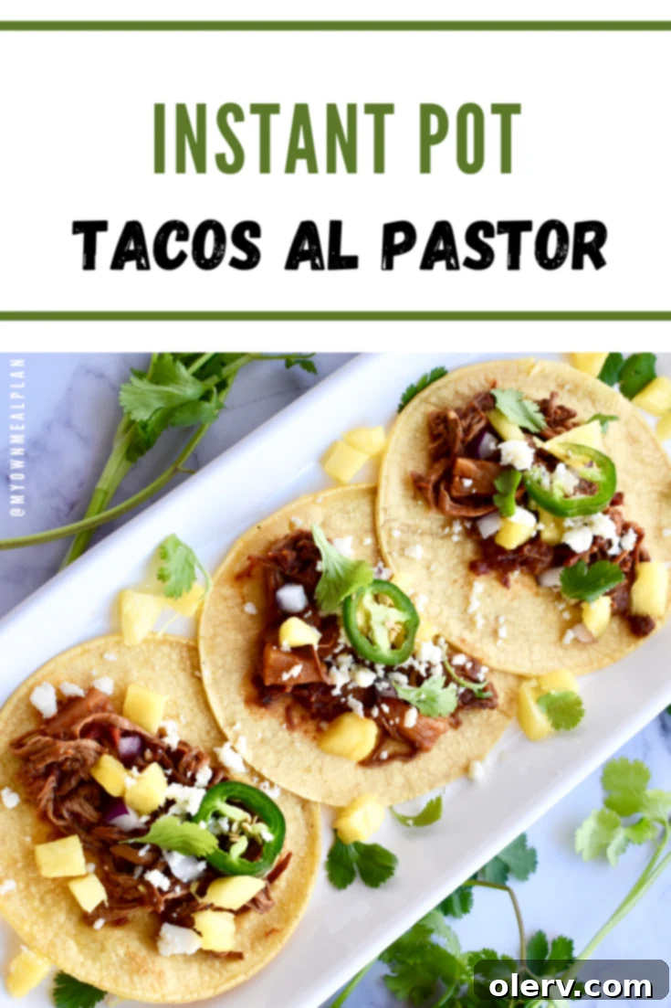 Instant Pot Tacos Al Pastor with lime and cilantro garnish