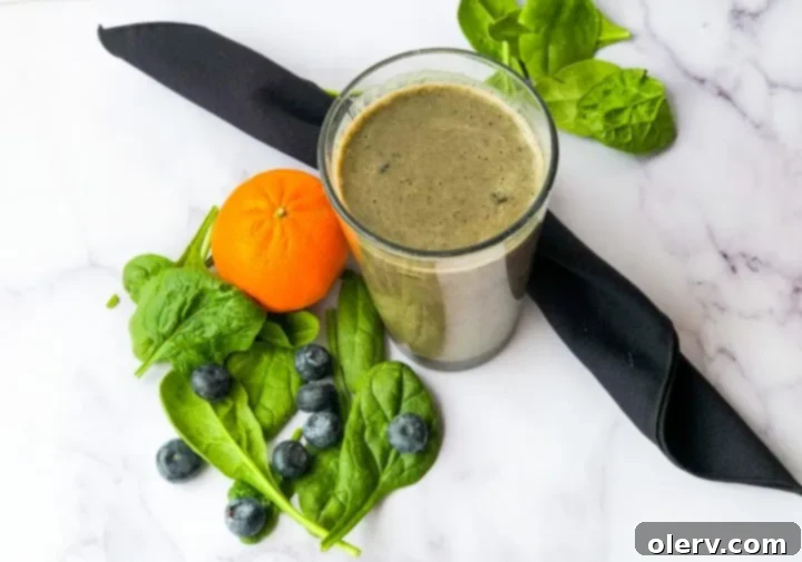 Nature's Immunity Elixir 3 Close-up of fresh ingredients for an immune booster green smoothie, including spinach, blueberries, and pineapple.