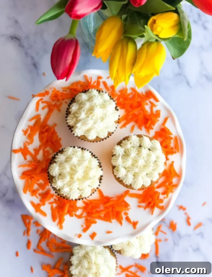 Spiced Carrot Cupcakes with Silky Cream Cheese Frosting 4 A beautifully frosted Carrot Cake Cupcake, ready to be pinned on Pinterest.
