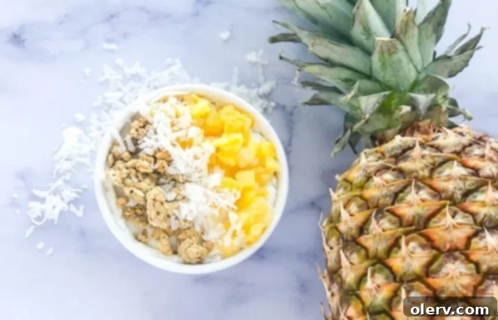Guilt-Free Pina Colada Parfait 2 Pina Colada Parfait with a spoon digging in
