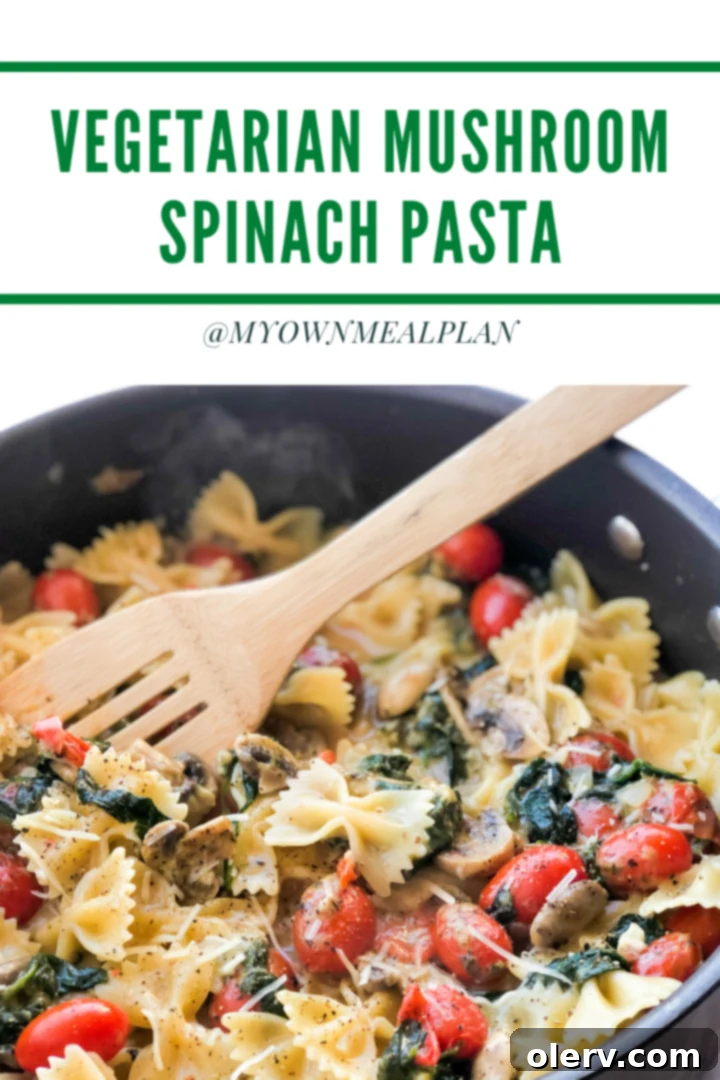 Mushroom Spinach Pasta in a rustic bowl, garnished with fresh herbs and a sprinkling of Parmesan