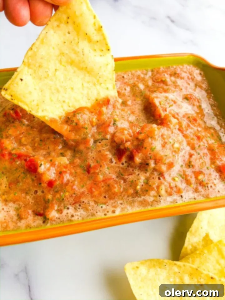 Effortless Blender Salsa 7 A square image for Pinterest, promoting the Simple Blender Salsa recipe, featuring a vibrant bowl of salsa and crispy tortilla chips.