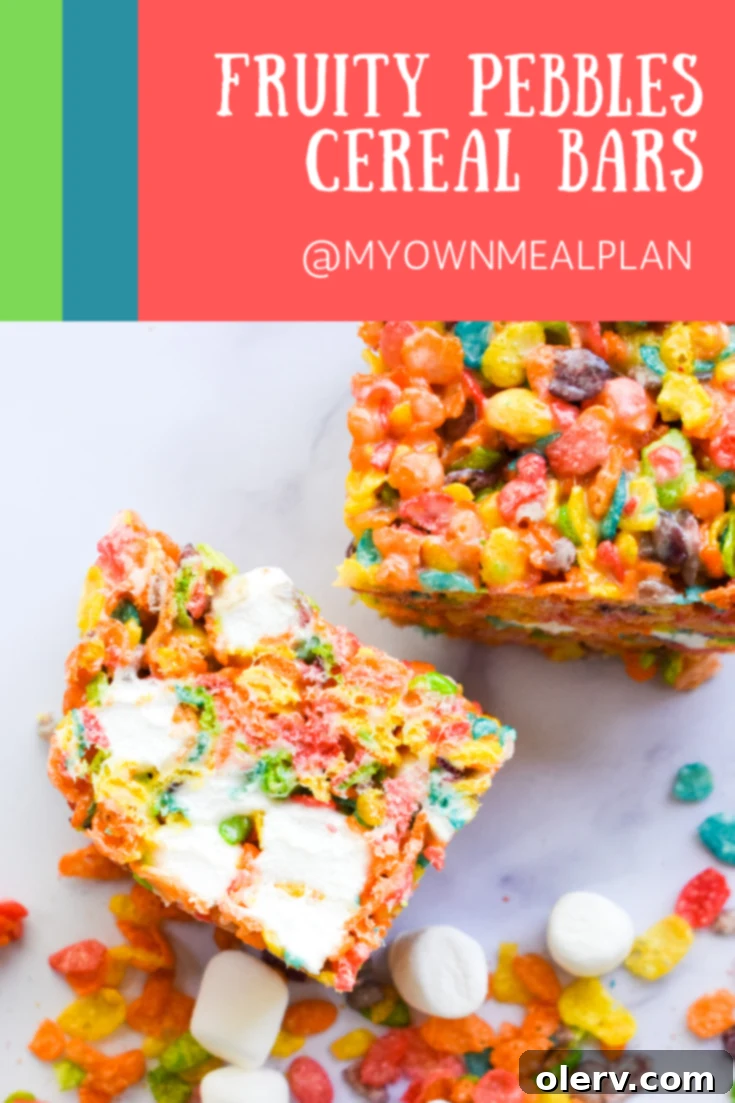 Beautifully stacked Fruity Pebbles Cereal Bars, a perfect sweet treat.