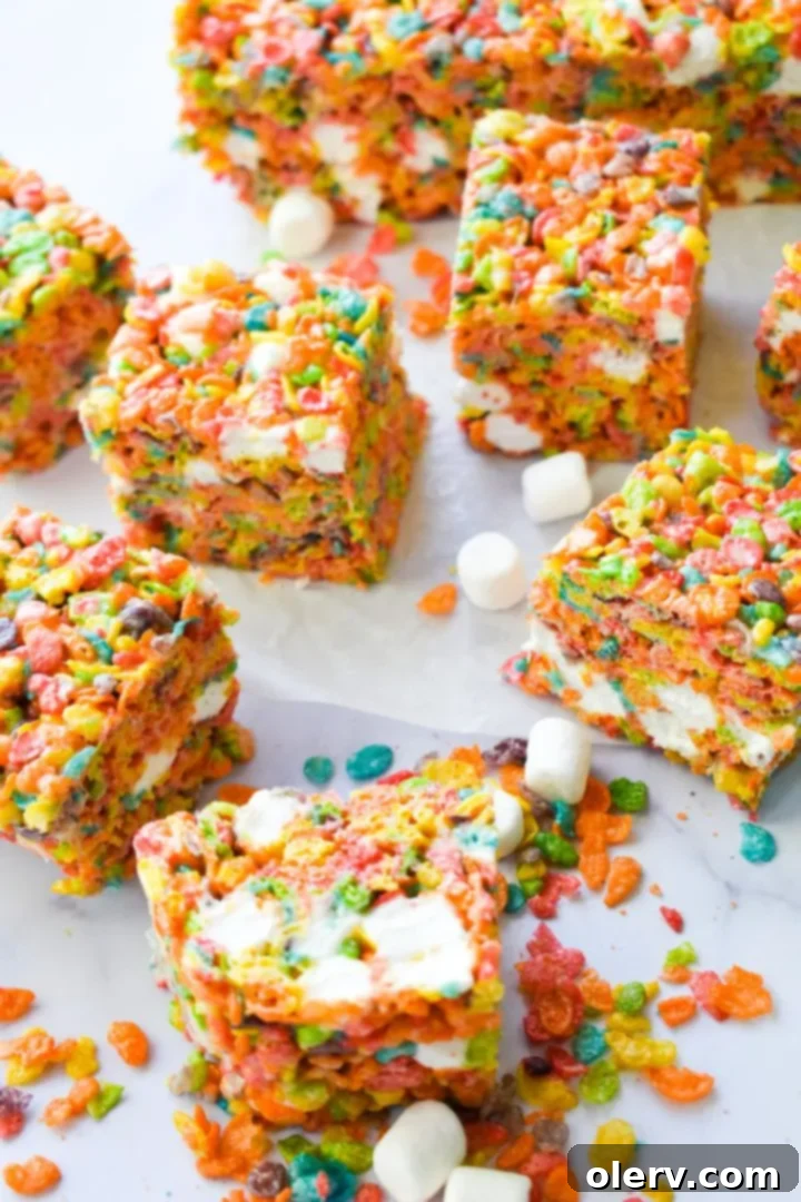Ultimate Fruity Pebbles Bars 4 A large bowl filled with colorful Fruity Pebbles cereal, ready to be mixed for the bars.