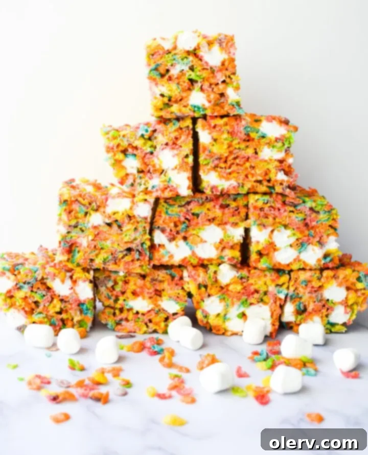 Ultimate Fruity Pebbles Bars 6 A close-up of the completed Fruity Pebbles Cereal Bars, showcasing their vibrant colors and perfect texture.