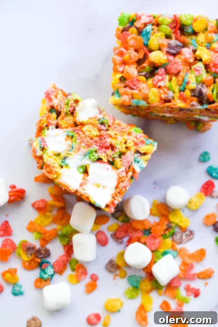 Ultimate Fruity Pebbles Bars 8 Fruity Pebbles Cereal Bars ready to be served, a perfect representation of the recipe.