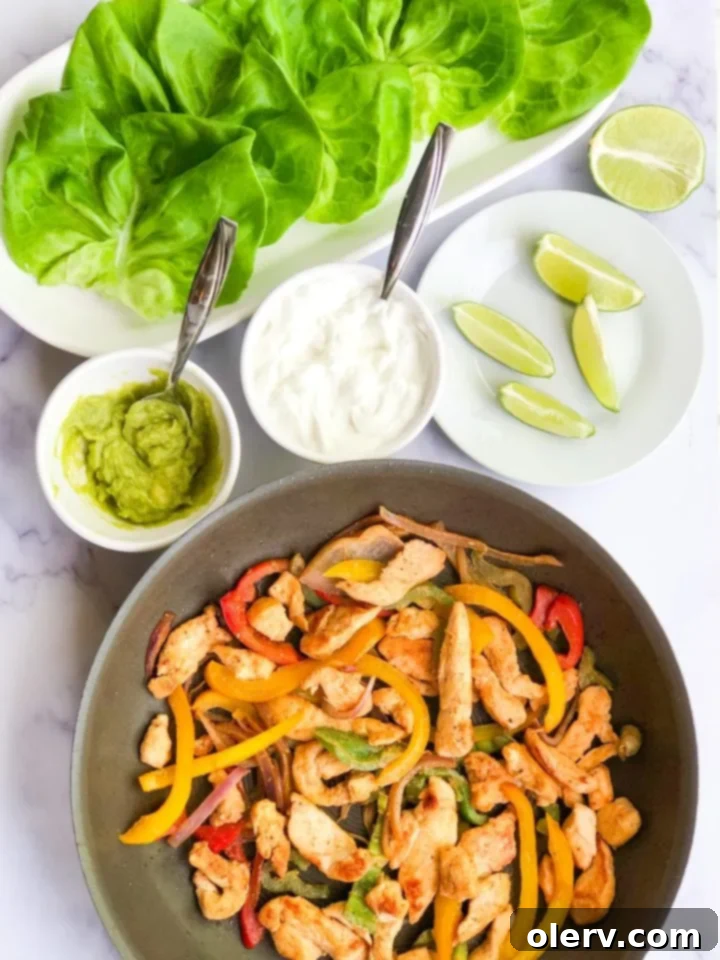 Low-Carb Chicken Fajita Lettuce Wraps 7 The finished platter of lettuce wrapped chicken fajitas with all the toppings.