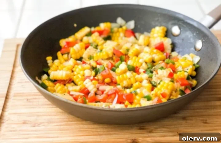 Spicy Jalapeño Corn 5 Fresh green jalapeño peppers on a wooden cutting board