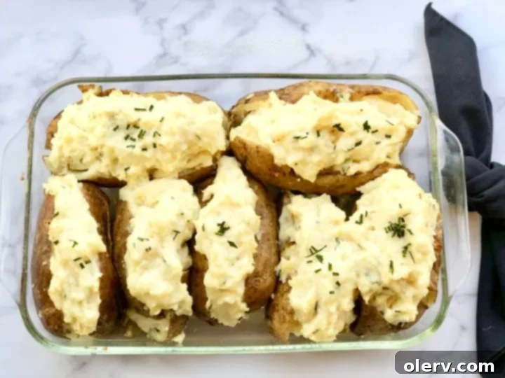 Twice-Baked Sour Cream and Chive Potatoes 2 Perfectly Golden Twice-Baked Sour Cream & Chive Potatoes, ready to serve