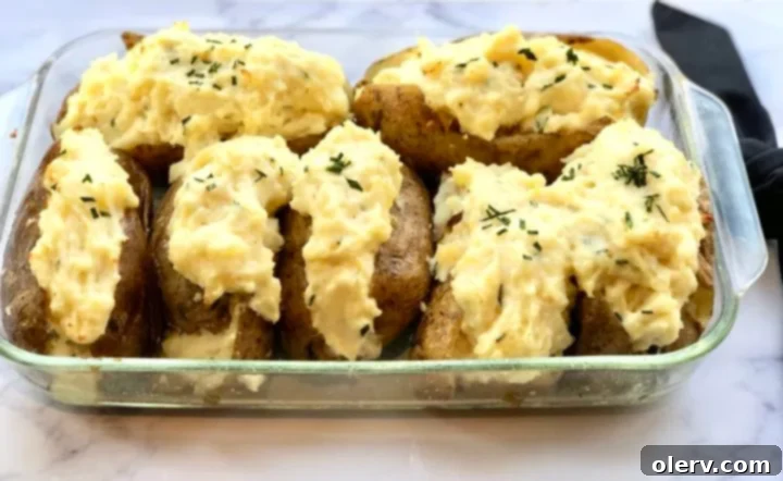 Twice-Baked Sour Cream and Chive Potatoes 3 Close-up of the creamy filling of a twice-baked potato being prepared
