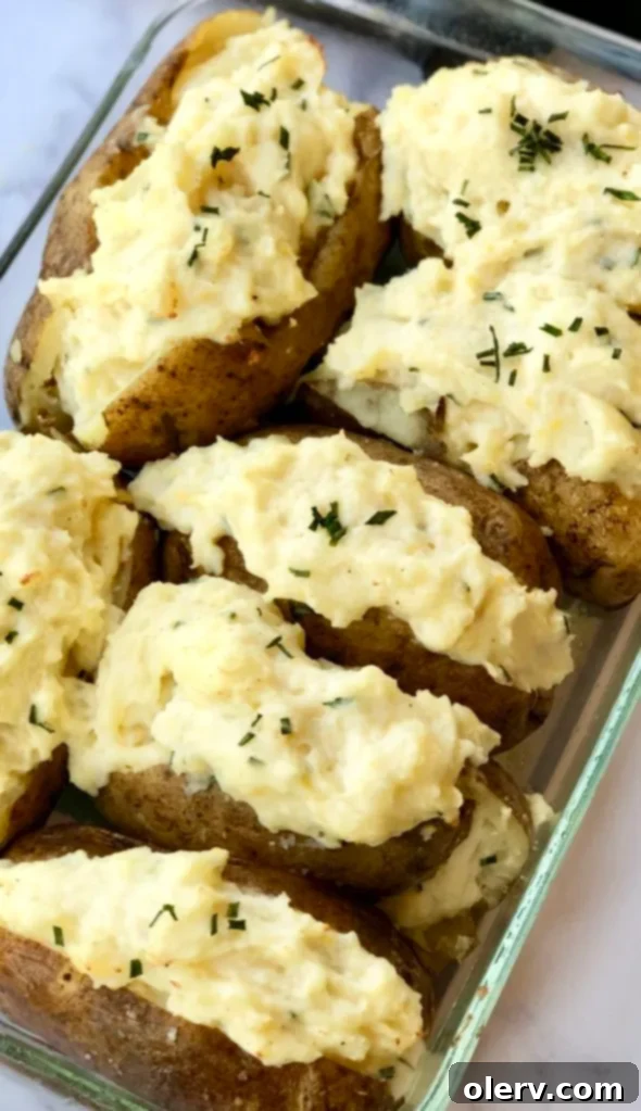 Twice-Baked Sour Cream and Chive Potatoes 4 A tray of twice-baked potatoes cooling slightly after the first bake