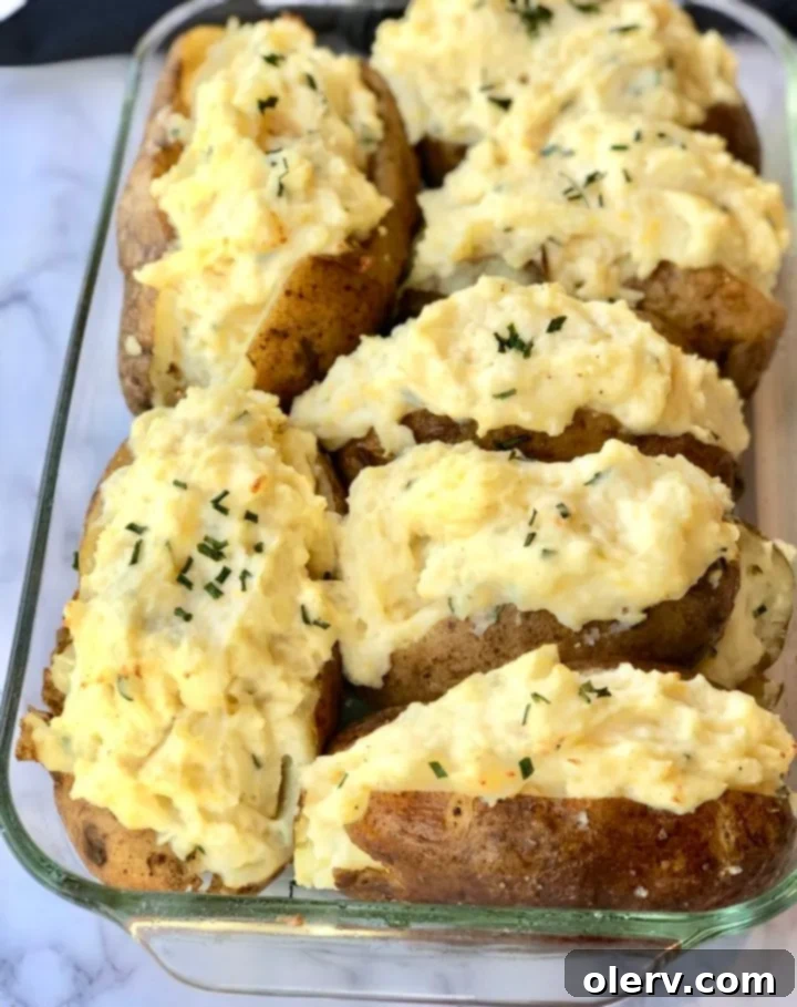 Twice-Baked Sour Cream and Chive Potatoes 6 The final delicious Twice-Baked Sour Cream & Chive Potatoes garnished with fresh chives