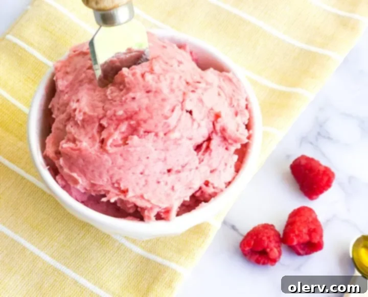 Whipped Raspberry Honey Delight 7 Serving of Raspberry Honey Butter on a plate with bread