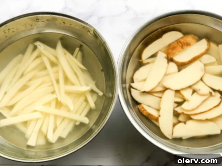 Mouthwatering Seasoned French Fries 5 Potatoes soaking in cold water to remove starch
