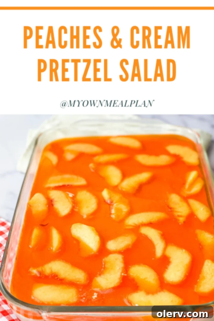 Pinterest image for Peaches & Cream Pretzel Salad, showcasing the delicious layers.