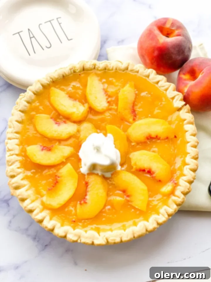 Golden Summer Peach Pie 4 A whole fresh peach pie cooling on a wire rack after baking