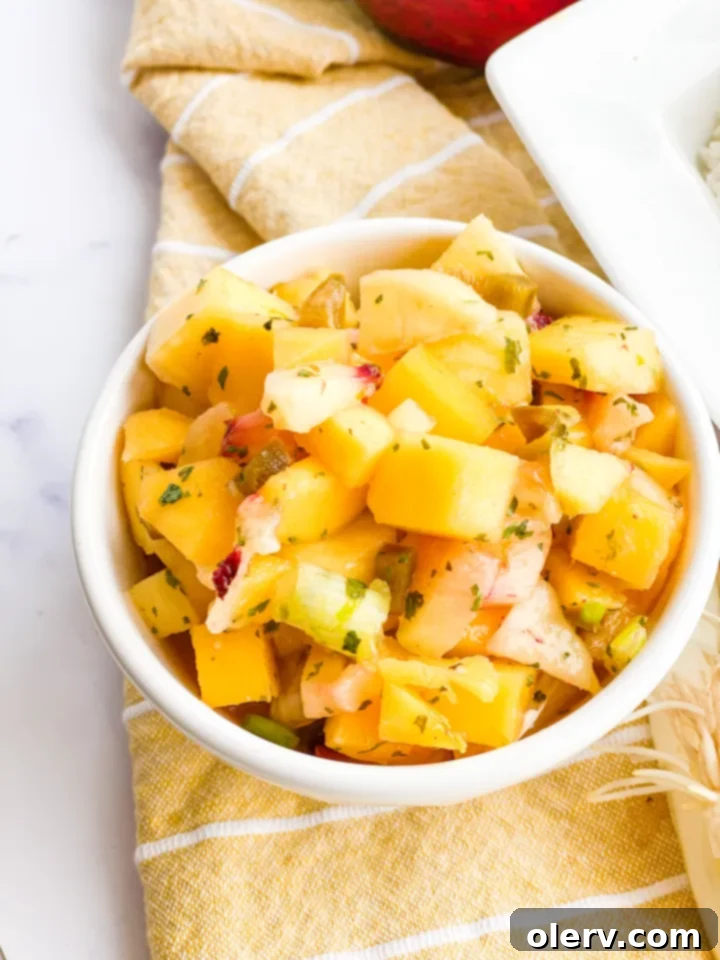 Flaky Air Fryer Halibut with Zesty Mango Salsa 5 Freshly diced mangoes, peaches, jalapeños, and green onions for mango salsa.