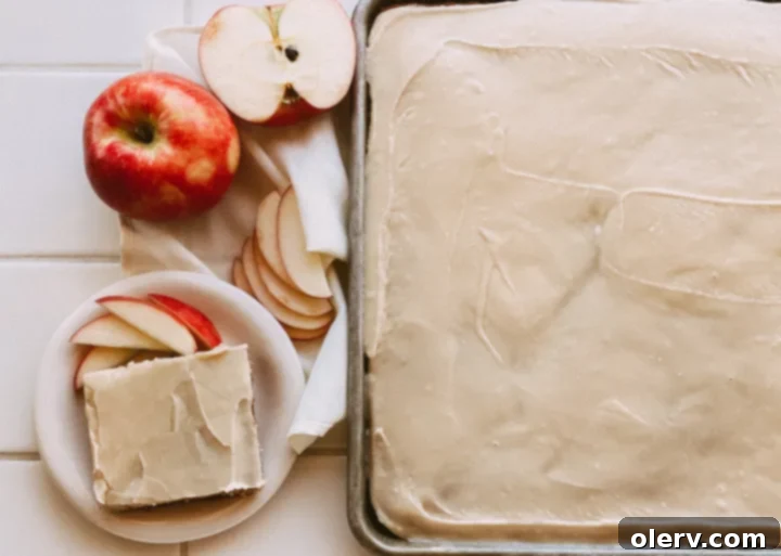 Nutty Brown Butter Apple Spice Cake 2 Apple Spice Cake with Brown Butter Glaze, showcasing a slice with the beautiful glaze