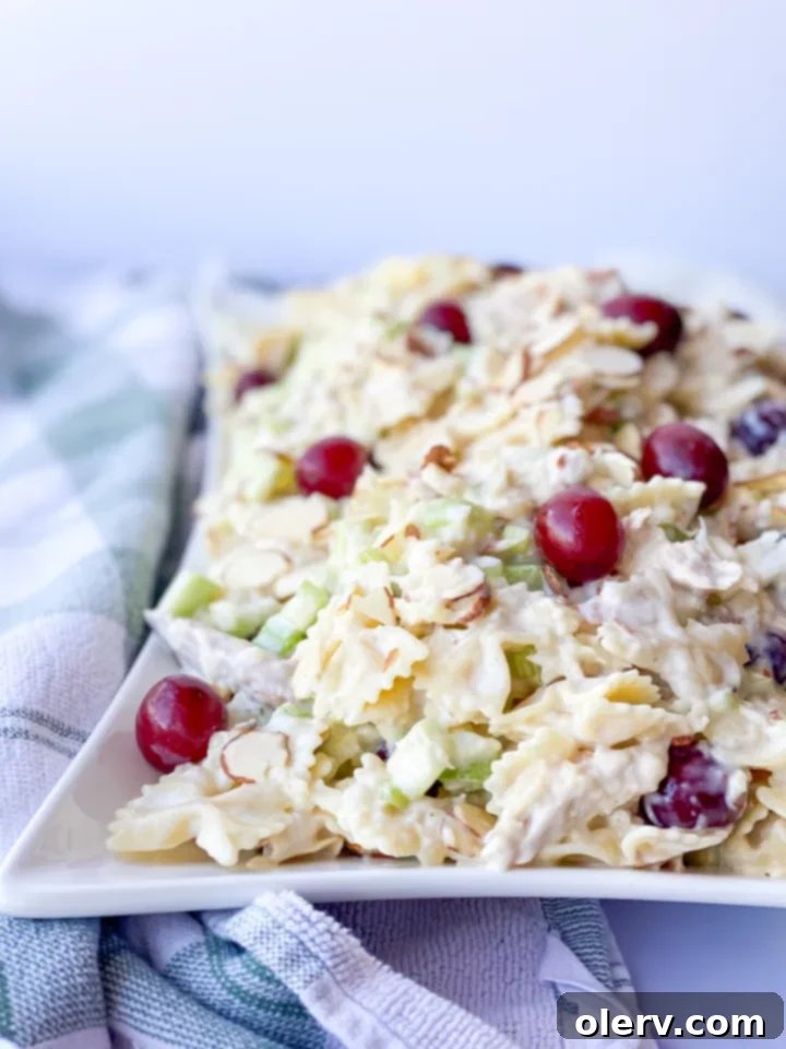 Tropical Sweet Pineapple Pasta Salad 3 Overhead shot of Sweet Pineapple Pasta Salad in a large serving bowl, garnished and ready to be enjoyed.