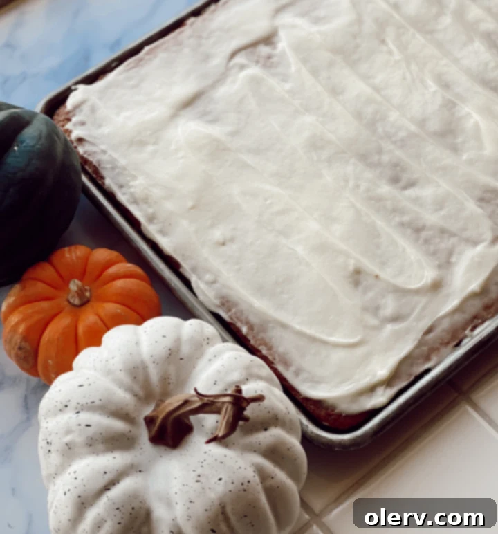 Golden Spiced Pumpkin Cake 6 Large slice of Pumpkin Spice Cake with glaze on a white plate