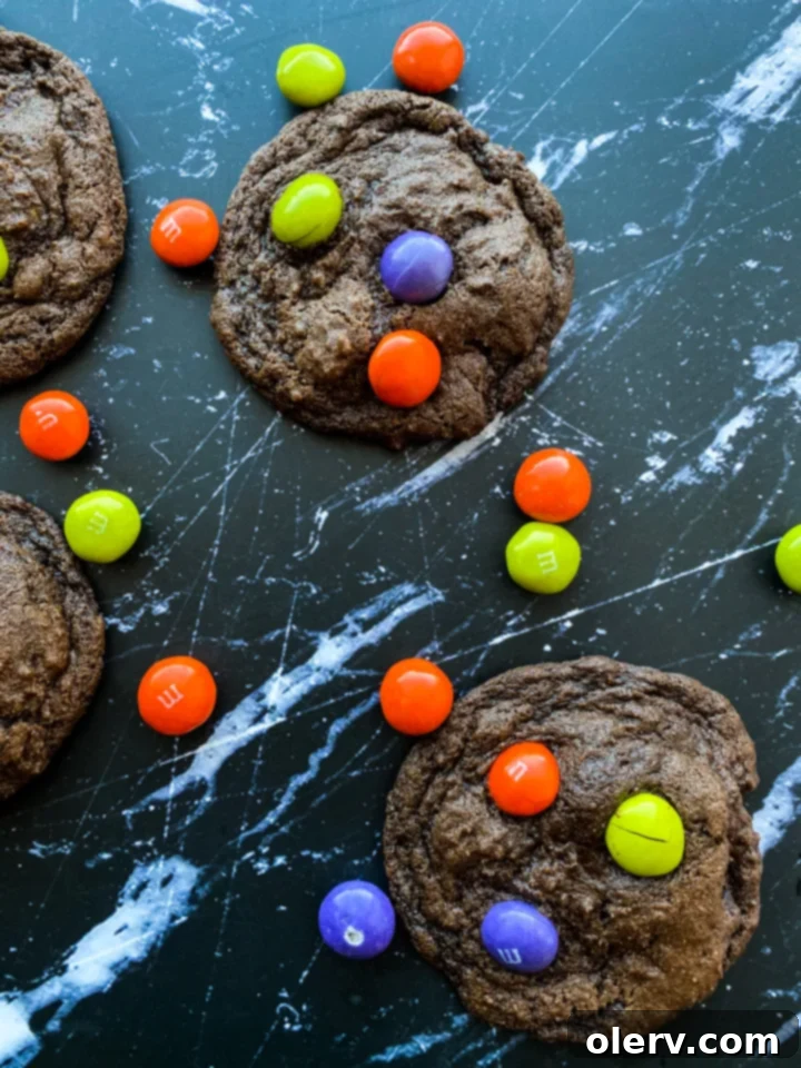 Spooktacular M&M Chocolate Cookies 6 Ingredients for Halloween M&M cookies laid out on a kitchen counter, ready for baking
