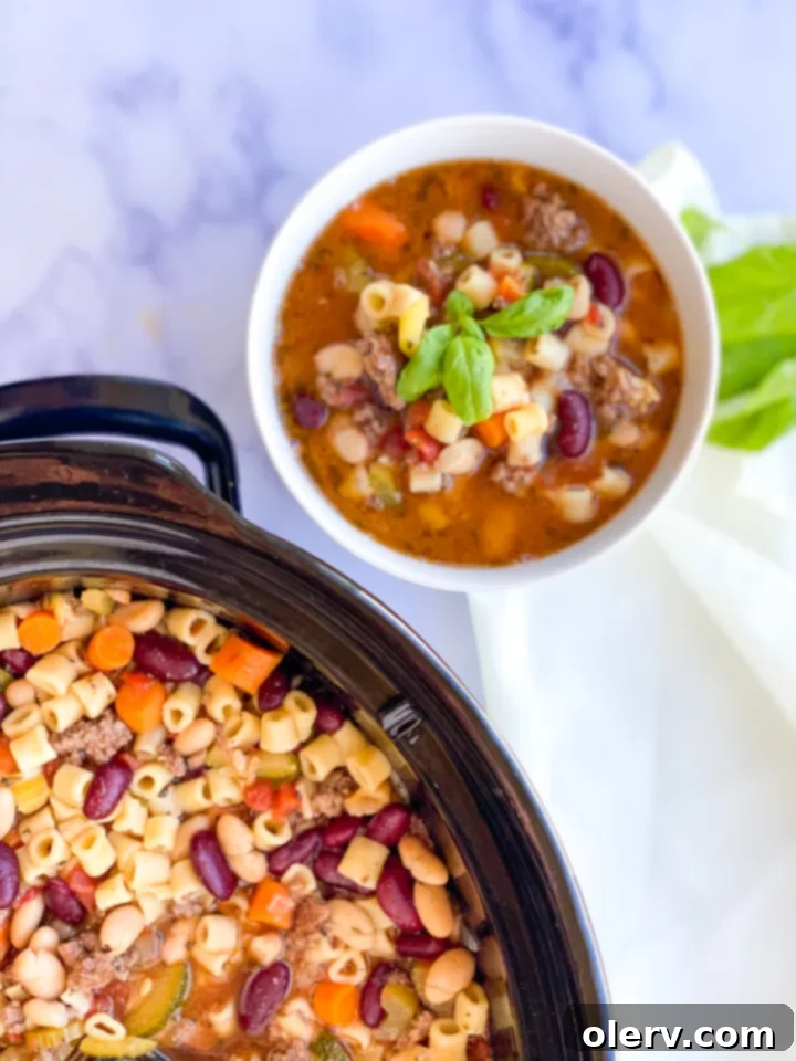 Effortless Comfort Pasta Fagioli 5 A spoonful of Slow Cooker Pasta E Fagioli, showing pasta, beans, and vegetables