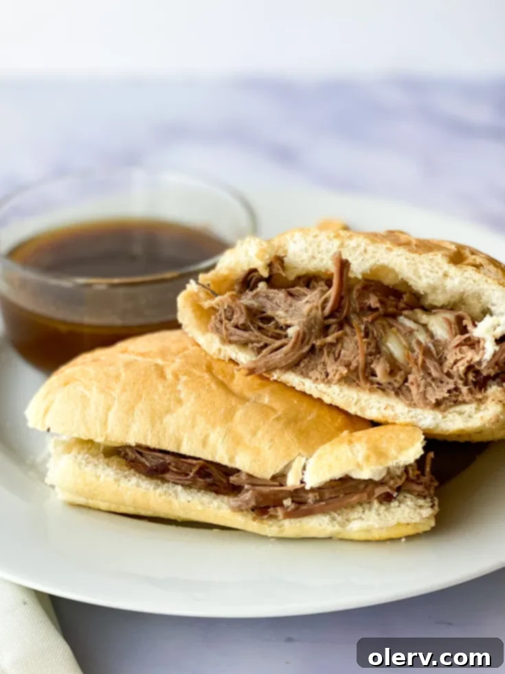 Ultimate Slow Cooker French Dip Sandwiches 8 A delicious Slow Cooker French Dip Sandwich with tender beef, melted Swiss cheese, and a side of au jus.