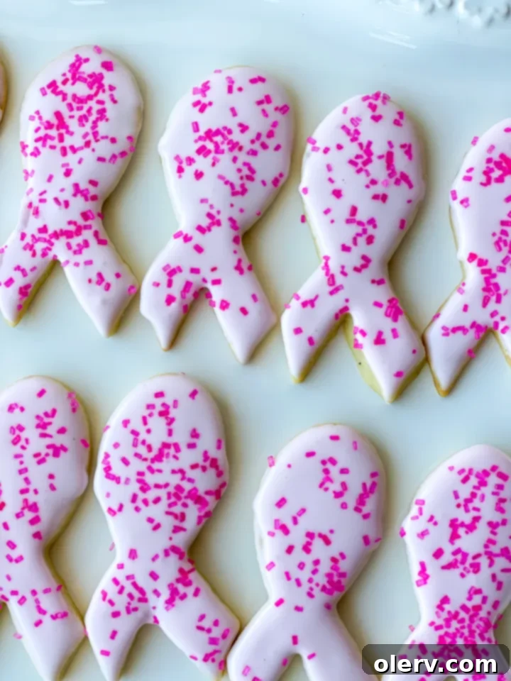 Pink Ribbon Cookie Treats 5 A plate of freshly baked and decorated pink sugar cookies, ready to be shared.