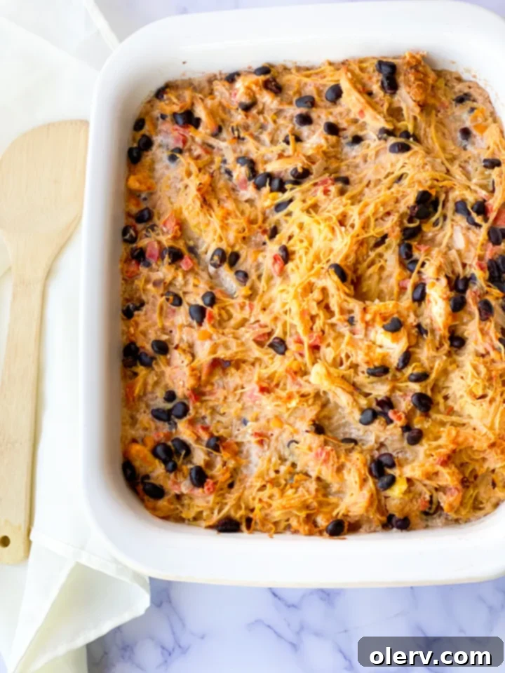 Spaghetti Squash Enchilada Bake 7 Spaghetti squash halves on a baking sheet, ready for the oven